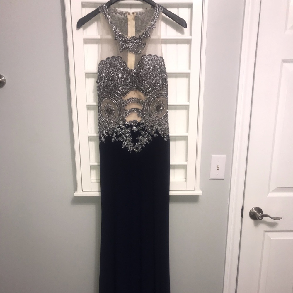 Beautiful beaded illusion gown with key hole cut out back